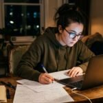 Applicant preparing a file for fully funded scholarships for international students.